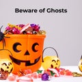 Beware of ghosts text on grey with jack o lantern buckets and trick or treat sweets