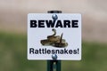 Beware of Rattlesnakes sign in the Badlands National Park during spring. Royalty Free Stock Photo