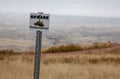 Beware of Rattlesnakes Sign in front of Grasslands