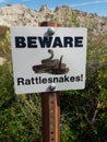 Beware Rattlesnakes warning sign in Badlands South Dakota