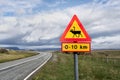 Beware of reindeer. Warning Sign next a paved street in Iceland