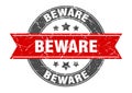 beware round stamp with ribbon. label sign Royalty Free Stock Photo
