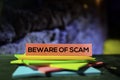 Beware of Scam on the sticky notes with bokeh background