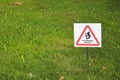 Beware of squirrel sign on grass close up Royalty Free Stock Photo