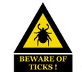 Beware of ticks, warning sign. Royalty Free Stock Photo