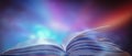 Bewitched Book With Magic Glows In The Darkness The blurred book that is bewitched with magic, the magic light in the dark, with. Royalty Free Stock Photo