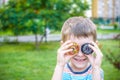 Boy playing with a beyblade spinning top outdoors