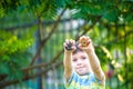 Boy playing with a beyblade spinning top outdoors