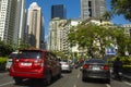 BGC, Taguig, Metro Manila, Philippines - Private vehicles drive along the modern BGC skyline in the morning. Point of