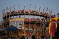 An outside shot of the wall of death at a festival surrounding NANDIGRAM BHARATKU