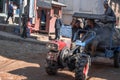 Three unidentified workers transports cargo by tractor on December 23, 2019 in Bhaktapur, Kathmandu, Nepal