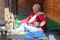 BHAKTAPUR, NEPAL - DECEMBER 29, 2014: An old woman spinning wool outside her home Royalty Free Stock Photo