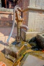 BHAKTAPUR, NEPAL - NOVEMBER 04, 2017: Close up of a metallic faucet at outdoors in Bhaktapur, this is the city with more