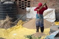 Nepali Woman Sifting Rice