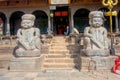 BHAKTAPUR, NEPAL - NOVEMBER 04, 2017: Street food market with some motorcycles parked in old and sandy street in a