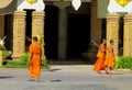 Young Buddhist monk samanera in Thailand temple wat walking on the street