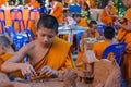 Buddhist young monks in Thailand temple wat doing hand crafts