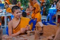 Buddhist young monk doing hand crafts