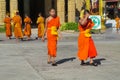 Buddhist young monks walk in the temple yard