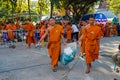 Buddhist young monks walk in the temple yard