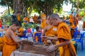 Buddhist young monks doing hand crafts in the temple yard