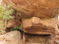 Bhimbetka rock shelter with model of Stone Age family as well as actual petroglyphs on cave ceiling, Madhya Pradesh, India Royalty Free Stock Photo