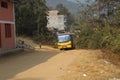 Bhojpur , Nepal - January 10, 2023 ,A bus is running on off road of Nepal , Dusty road of Nepal