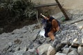 Bhojpur , Nepal - January 10, 2023 : Workers working in a stone crushing factory. Where men and women are working equally together