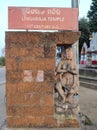 Ancient idol of Hindu deity placed near the sign board at the sacred temple of lord Lingaraj.