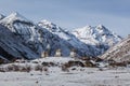 Bhuddist stupas in snowy Himalayan mountains, Bhutan Royalty Free Stock Photo