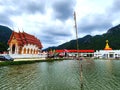 Bhuddist temple in Thailand in front of mountains Royalty Free Stock Photo