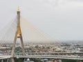 Bhumibol Bridge with river, cityscape view and cloudy sky in the morning Royalty Free Stock Photo