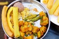 Bhungara Bateta indian potato In White Dish Bhungla batata is a popular street food of Gujarat,