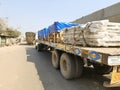 Bhusawal, INDIA - Feb 13, 2021, Trucks running pass the road on highway road in mountain, state of maharashtra, India Royalty Free Stock Photo