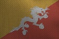 Bhutan flag depicted in paint colors on old brushed metal plate or wall closeup. Textured banner on rough background Royalty Free Stock Photo