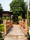 Bhutan traditional bridge and gazebo in garden Royalty Free Stock Photo