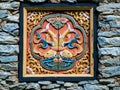 Bhutan traditional wooden decoration in rock wall