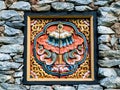 Bhutan traditional wooden decoration in rock wall