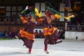 Bhutanese Cham dance , masked dancers leap into the air .Bumthang, central Bhutan. Royalty Free Stock Photo