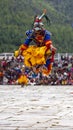 Bhutanese Cham masked dance, bird mask dancer leap into the air , Bhutan Royalty Free Stock Photo