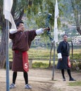 Bhutanese men competes in a game of archery in Timphu, Bhutan. Royalty Free Stock Photo
