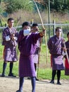 Bhutanese men competes in a game of archery in Timphu, Bhutan. Royalty Free Stock Photo