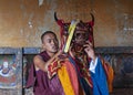 A Bhutanese monk makes up as buffalo head god for lama dance . Bumthang, central Bhutan.