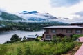 Bhutanese village near the river on a foggy day at Punakha, Bhutan Royalty Free Stock Photo