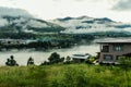 Bhutanese village near the river on a foggy day at Punakha, Bhutan Royalty Free Stock Photo