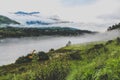 Bhutanese village near the river on a foggy day at Punakha, Bhutan Royalty Free Stock Photo