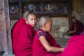 A Bhutanese young novice monk turn his head to gaze the sky during study , Bhutan