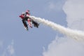 Bi-plane upside down in cloudy sky Royalty Free Stock Photo