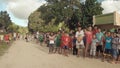 BIABAS, BOHOL, PHILIPPINES - DECEMBER 5, 2015: Tourist launches drone for school children and communicate with them.