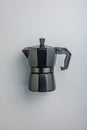 Bialetti moka pot. Coffee maker on gray background. Top view Royalty Free Stock Photo